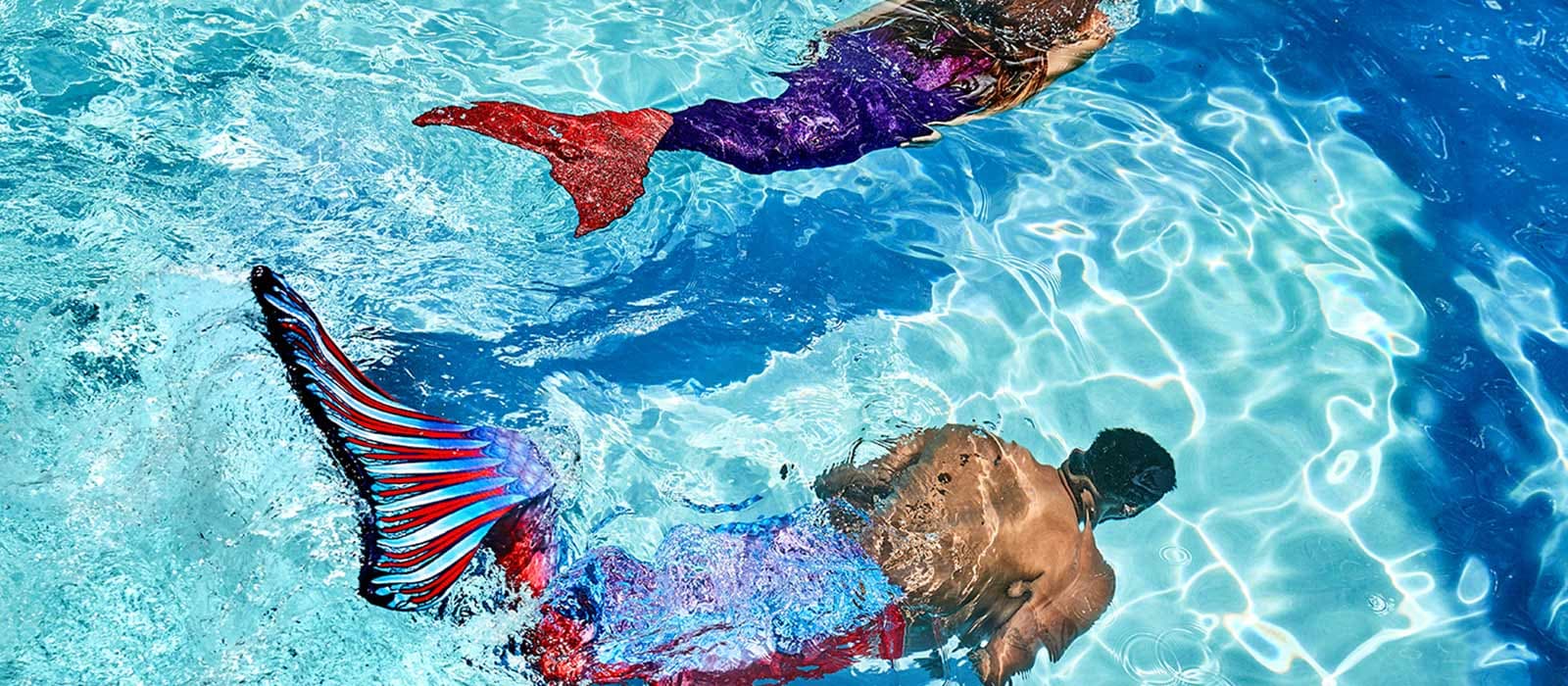 Image with beautiful mermaids under the water