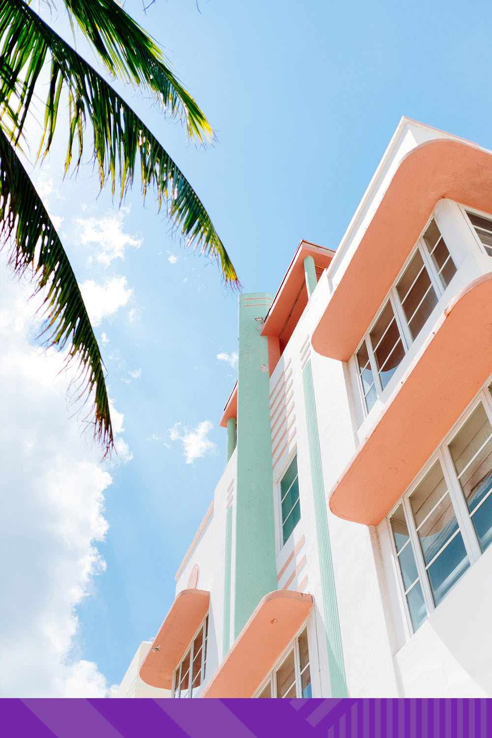 A shot of a building in Miami with an illustrated, color-block sky.