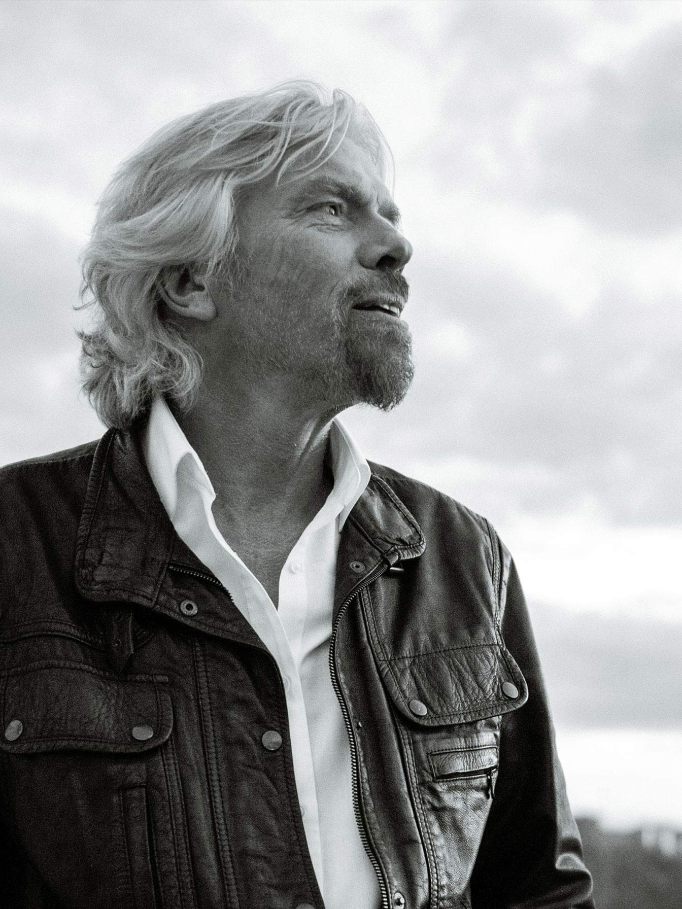 A black and white portrait of Richard Branson.