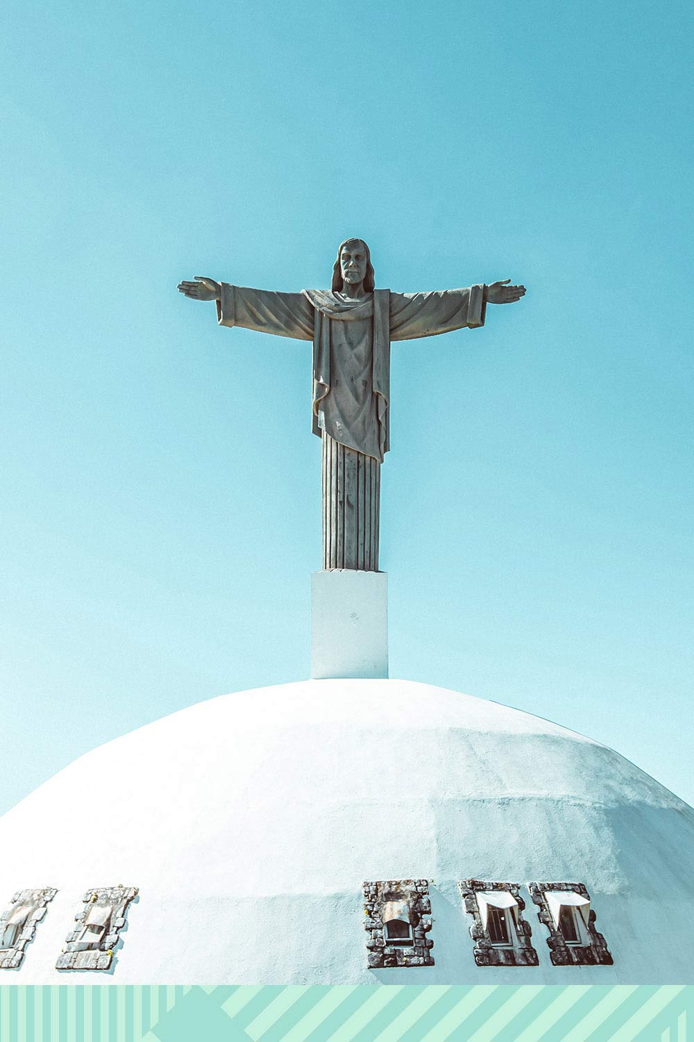 An image of Jesus atop a dome church